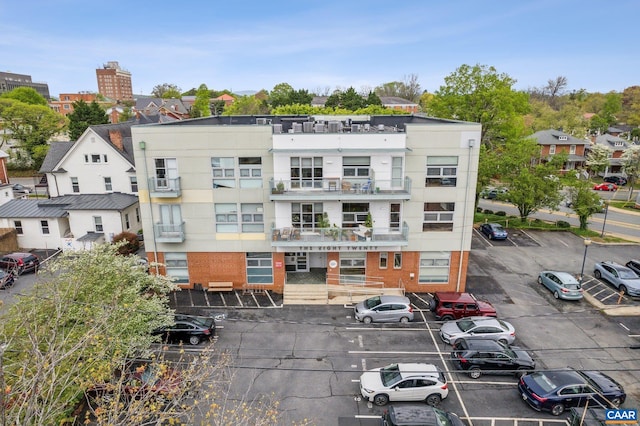 view of building exterior featuring uncovered parking