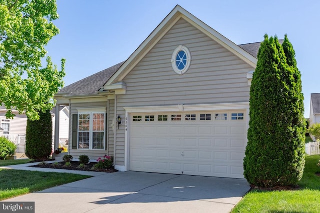 6304 Dranesville Dr W, Fredericksburg, VA 22407 - view of front of house with concrete driveway, a shingled roof, and an attached garage