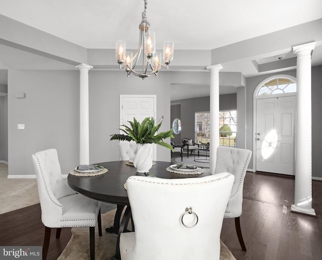 6304 Dranesville Dr W, Fredericksburg, VA 22407 - dining room with dark wood-style flooring, decorative columns, and a chandelier