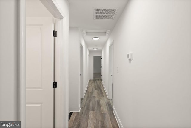  - hall with attic access and dark wood finished floors