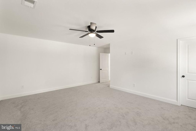  - empty room featuring ceiling fan, light colored carpet, and baseboards