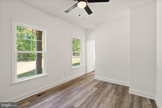  - spare room with wood finished floors and ceiling fan