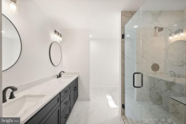  - full bathroom featuring marble finish flooring, double vanity, a shower stall, and baseboards