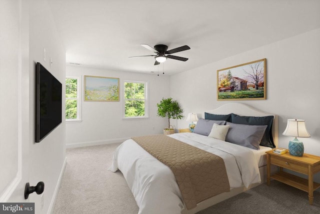  - carpeted bedroom with baseboards and a ceiling fan