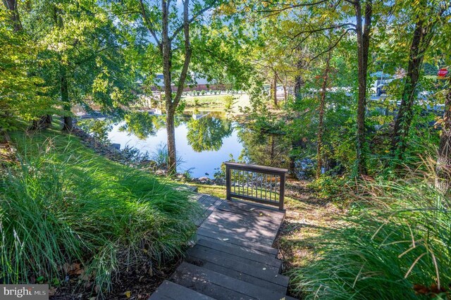 surrounding community with a water view