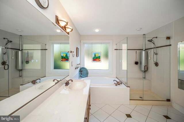 bathroom featuring a bath, a stall shower, tile patterned floors, and vanity