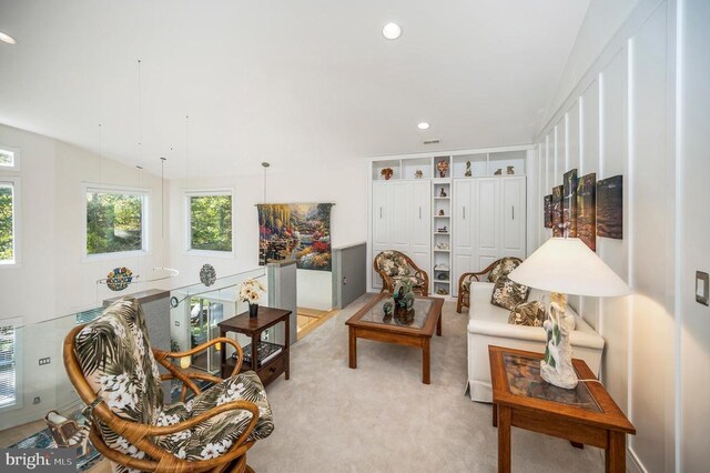 living room with light carpet and recessed lighting