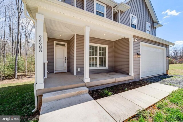 26288 Wisdom Tree Ln, Unionville, VA 22567 - doorway to property with covered porch and a garage