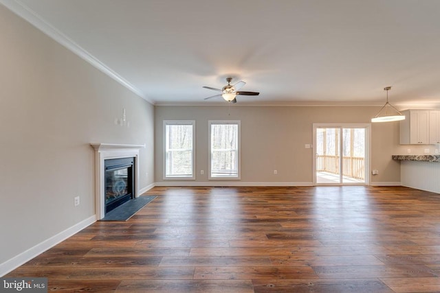 26288 Wisdom Tree Ln, Unionville, VA 22567 - unfurnished living room with a ceiling fan, plenty of natural light, a fireplace with flush hearth, dark wood-type flooring, and ornamental molding