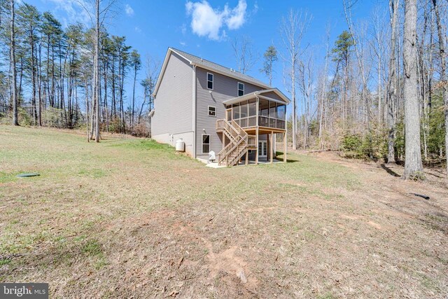 26288 Wisdom Tree Ln, Unionville, VA 22567 - back of house with a sunroom, a yard, and stairs