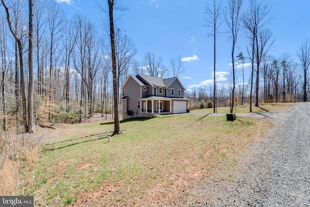 26288 Wisdom Tree Ln, Unionville, VA 22567 - traditional-style home featuring a garage, a front yard, driveway, and a porch