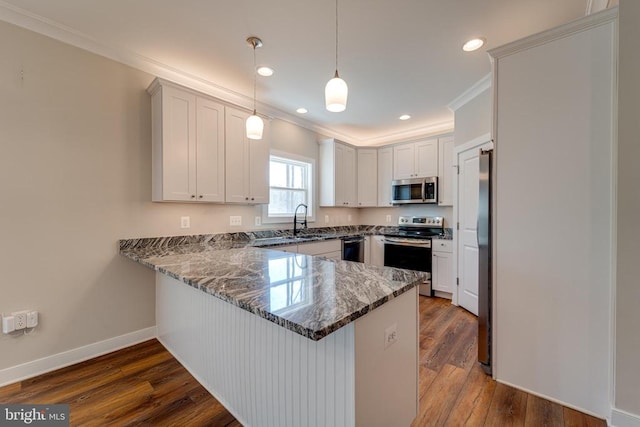 26288 Wisdom Tree Ln, Unionville, VA 22567 - kitchen featuring stainless steel appliances, a peninsula, crown molding, dark stone counters, and recessed lighting