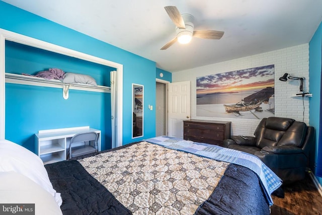 bedroom with a ceiling fan and wood finished floors