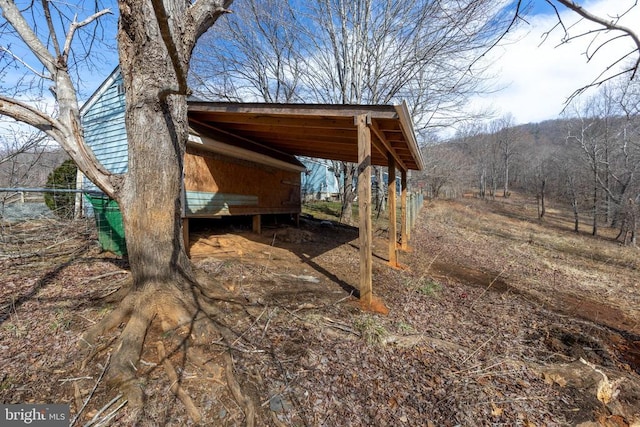 view of yard with a detached carport