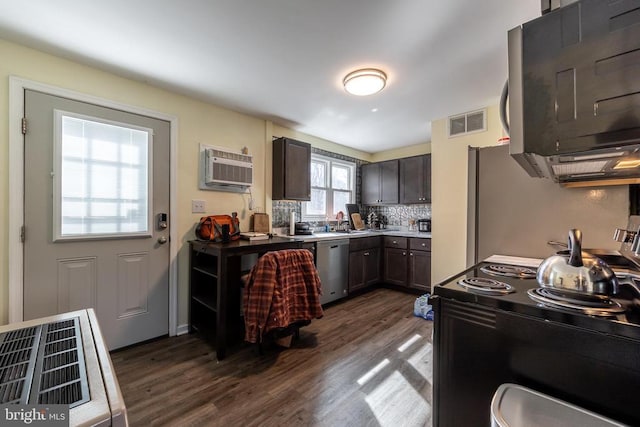 kitchen featuring visible vents, stainless steel dishwasher, electric range oven, an AC wall unit, and dark brown cabinets