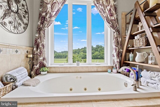 bathroom with a whirlpool tub