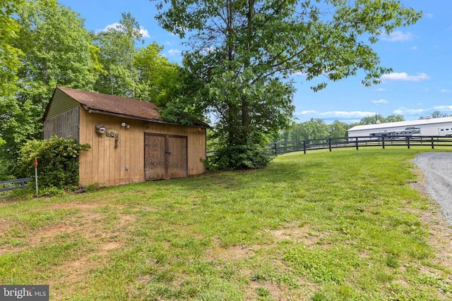 view of yard with an outdoor structure and a storage shed
