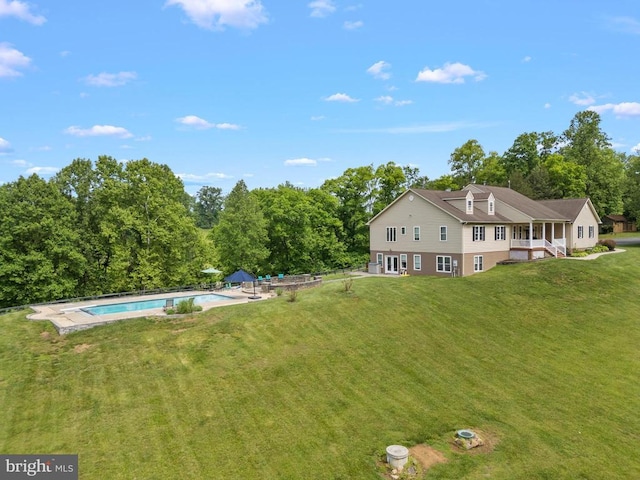 view of subject property with a pool area