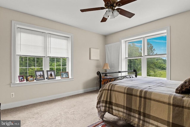 bedroom featuring baseboards, carpet floors, and ceiling fan