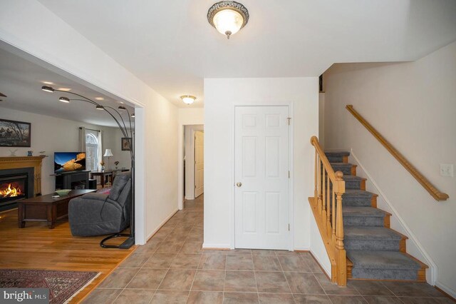 6117 Block House Rd, Partlow, VA 22534 - entryway featuring stairs and a glass covered fireplace