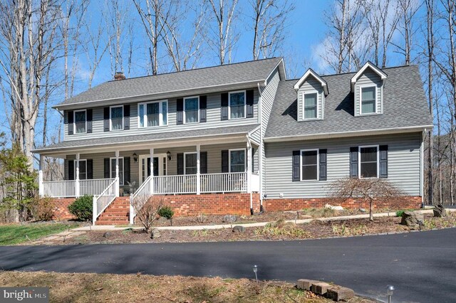 6117 Block House Rd, Partlow, VA 22534 - colonial home with a porch, a shingled roof, and a chimney