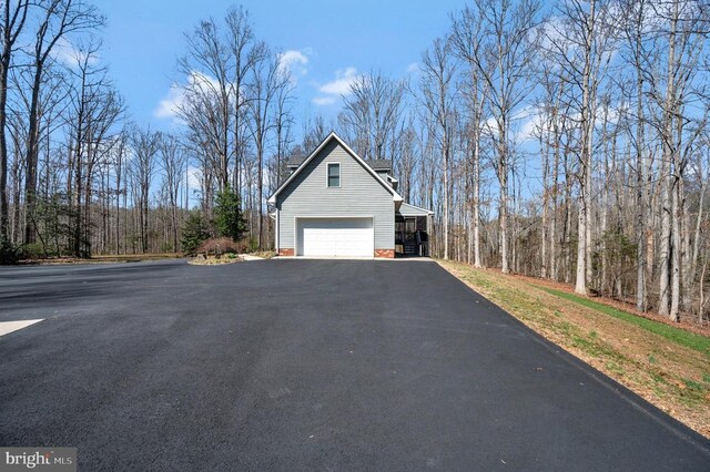 6117 Block House Rd, Partlow, VA 22534 - view of home's exterior with an attached garage and asphalt driveway
