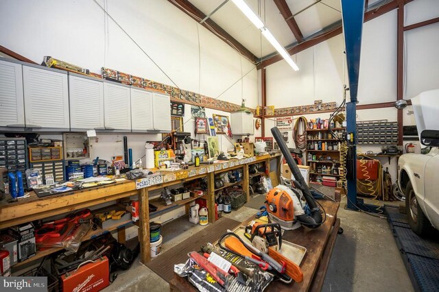 6117 Block House Rd, Partlow, VA 22534 - misc room featuring a workshop area, concrete flooring, and high vaulted ceiling