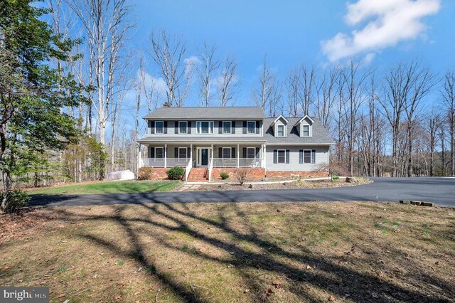 6117 Block House Rd, Partlow, VA 22534 - view of front of house with covered porch, a front yard, and a chimney