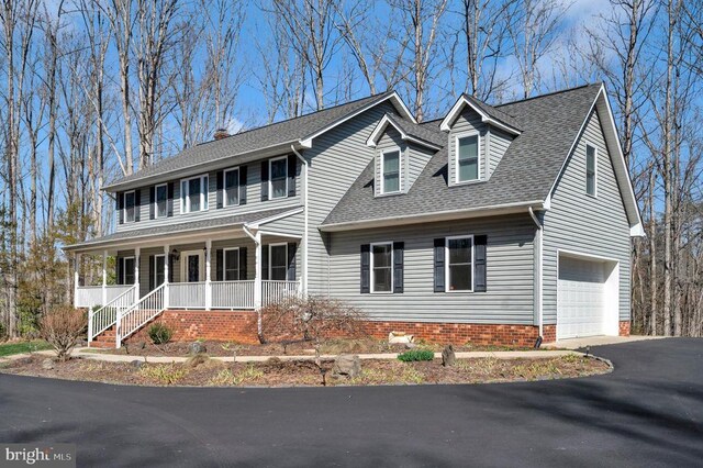 6117 Block House Rd, Partlow, VA 22534 - colonial house featuring a porch, an attached garage, roof with shingles, and asphalt driveway