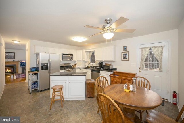 6117 Block House Rd, Partlow, VA 22534 - kitchen featuring appliances with stainless steel finishes, a sink, white cabinetry, and dark countertops