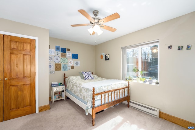 1800 Jefferson Park Ave Unit 39, Charlottesville, VA 22903 - bedroom with a baseboard heating unit, light colored carpet, baseboards, and ceiling fan