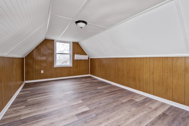 129 Hillwood Dr, Front Royal, VA 22630 - bonus room featuring wood finished floors, vaulted ceiling, and wood walls
