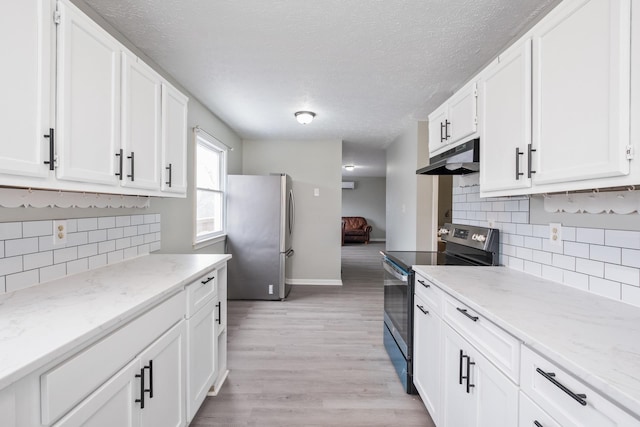 129 Hillwood Dr, Front Royal, VA 22630 - kitchen featuring appliances with stainless steel finishes, under cabinet range hood, white cabinets, backsplash, and a textured ceiling