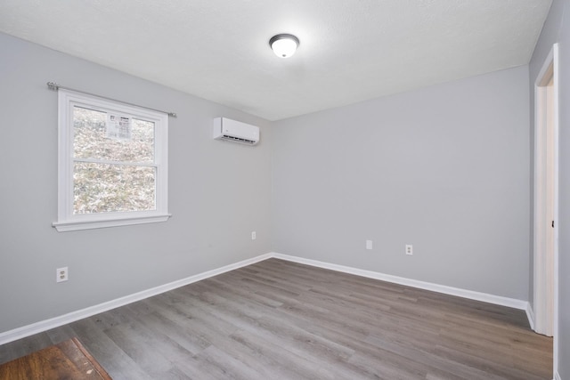 129 Hillwood Dr, Front Royal, VA 22630 - empty room featuring a wall mounted AC and wood finished floors