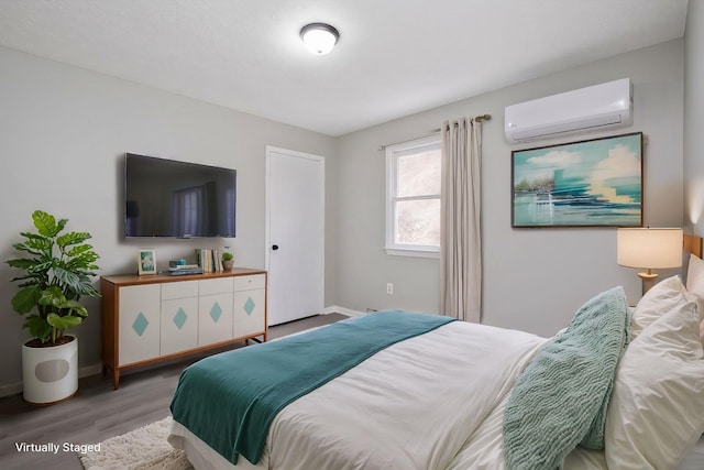 129 Hillwood Dr, Front Royal, VA 22630 - bedroom with an AC wall unit and wood finished floors