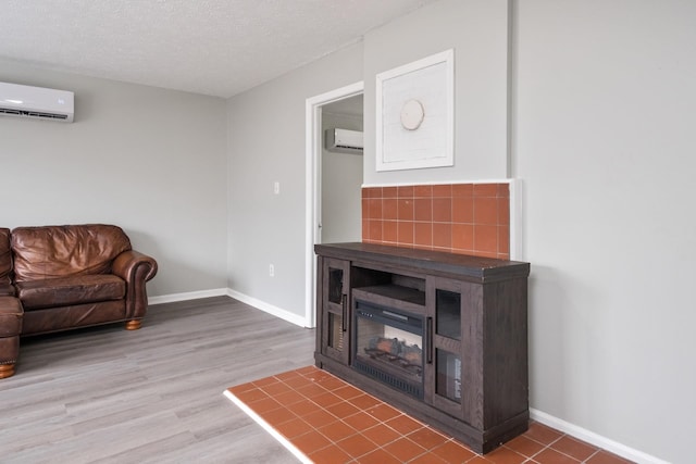 129 Hillwood Dr, Front Royal, VA 22630 - living room featuring an AC wall unit, wood finished floors, and a textured ceiling