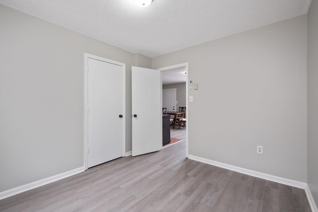 129 Hillwood Dr, Front Royal, VA 22630 - unfurnished room featuring wood finished floors and a textured ceiling