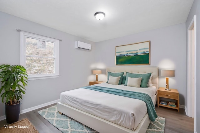 129 Hillwood Dr, Front Royal, VA 22630 - bedroom featuring a wall mounted air conditioner and wood finished floors