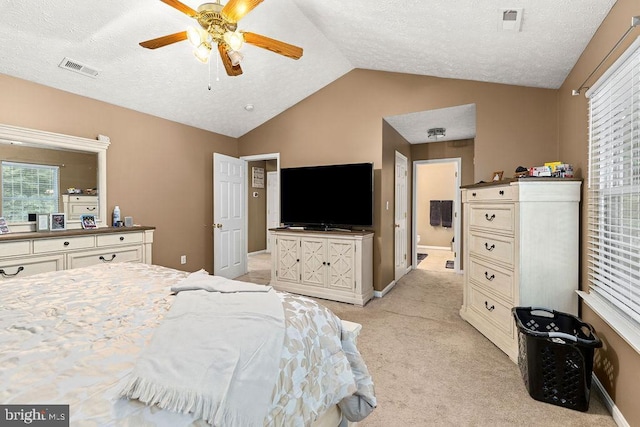 12407 Salient Ln, Spotsylvania, VA 22551 - bedroom with light colored carpet, lofted ceiling, a textured ceiling, ensuite bath, and ceiling fan