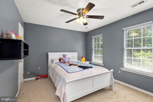 12407 Salient Ln, Spotsylvania, VA 22551 - carpeted bedroom with a textured ceiling and ceiling fan
