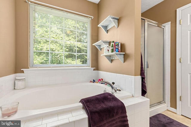 12407 Salient Ln, Spotsylvania, VA 22551 - full bath featuring a shower stall, plenty of natural light, and a bath