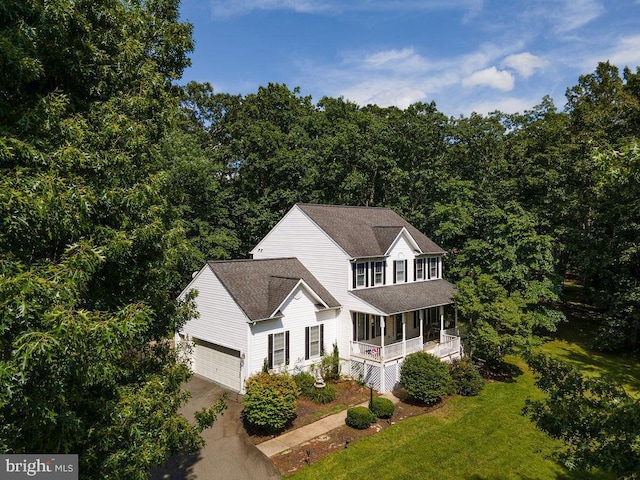 12407 Salient Ln, Spotsylvania, VA 22551 - view of front of property with covered porch, driveway, a front yard, an attached garage, and a shingled roof