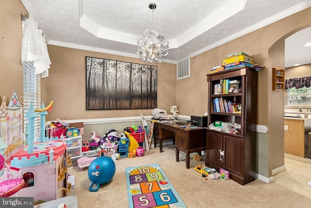 12407 Salient Ln, Spotsylvania, VA 22551 - playroom with arched walkways, a textured ceiling, carpet, a raised ceiling, and crown molding