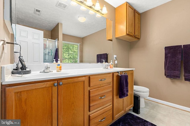 12407 Salient Ln, Spotsylvania, VA 22551 - full bathroom with a shower stall, double vanity, a textured ceiling, and tile patterned floors