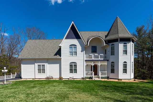 91 Twin Hills Ln, Fishersville, VA 22980 - victorian-style house with a balcony, a front yard, a porch, and roof with shingles
