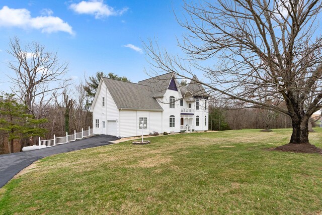 91 Twin Hills Ln, Fishersville, VA 22980 - view of front facade featuring driveway, fence, a garage, roof with shingles, and a front lawn