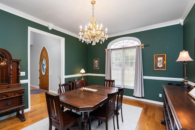 91 Twin Hills Ln, Fishersville, VA 22980 - dining room featuring ornamental molding, a notable chandelier, baseboards, and wood finished floors