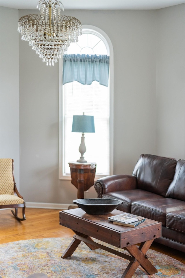 91 Twin Hills Ln, Fishersville, VA 22980 - living room with baseboards, an inviting chandelier, and wood finished floors