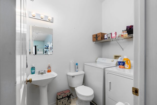 91 Twin Hills Ln, Fishersville, VA 22980 - bathroom with washing machine and clothes dryer, toilet, and a sink