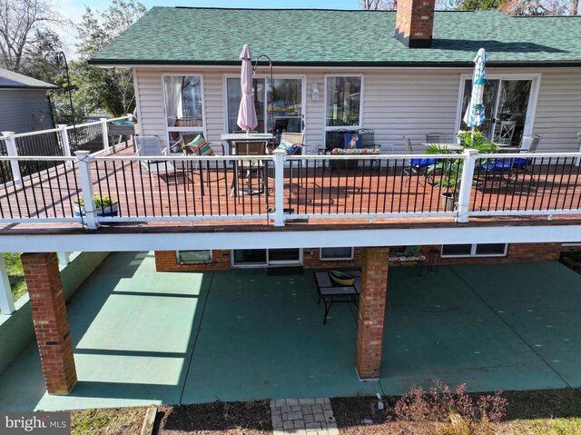 107 Ramsay Rd, Locust Grove, VA 22508 - rear view of house featuring a chimney, a patio area, a shingled roof, and outdoor dining area